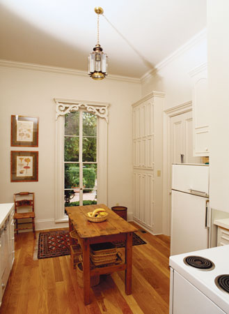 As this serene kitchen demonstrates, space is a powerful force in design. Extraneous furnishings block energy.